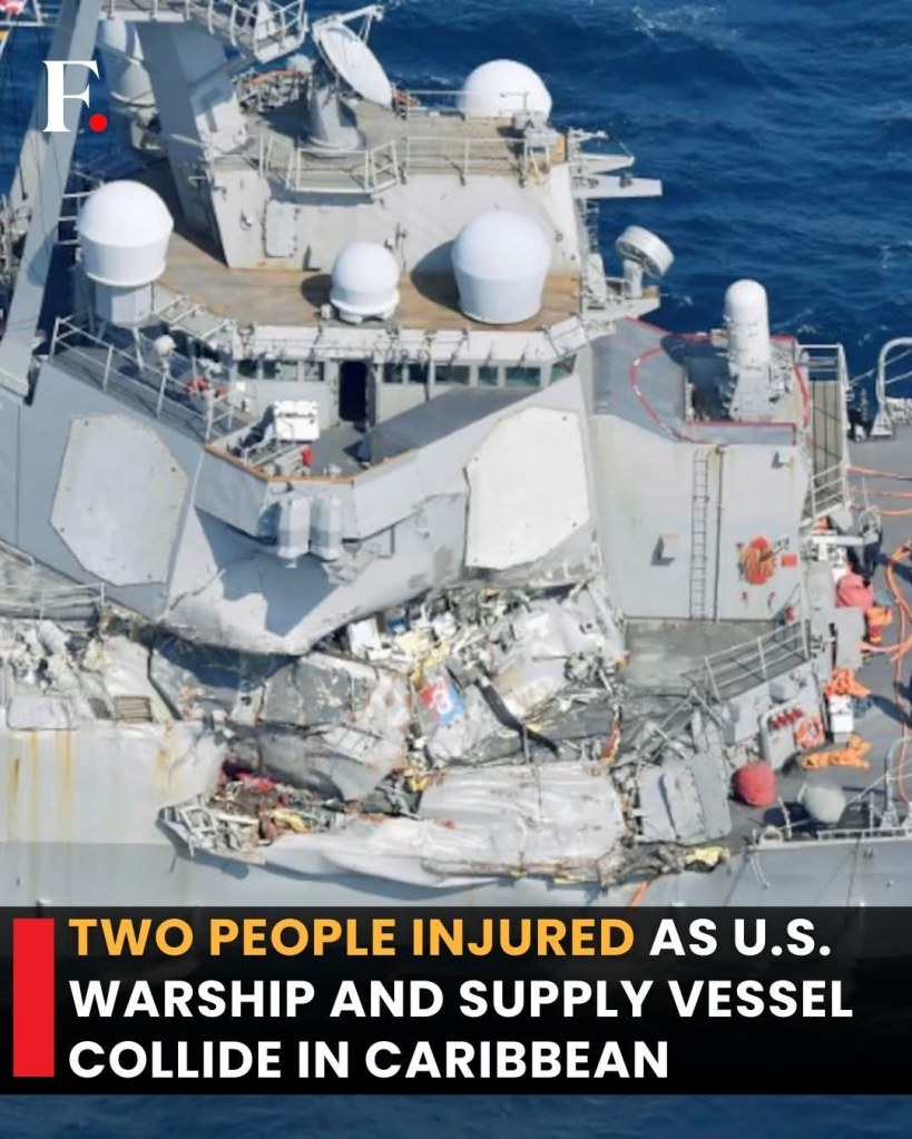 A photo of a US warship that has been damaged colliding with a supply vessel.