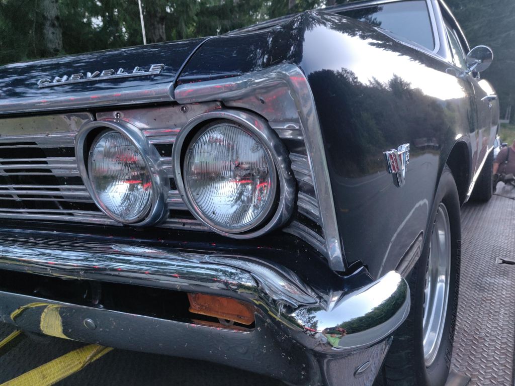 Close up of the front grill. 1966 or 67 Chevy Chevelle at a car show. Black in color.