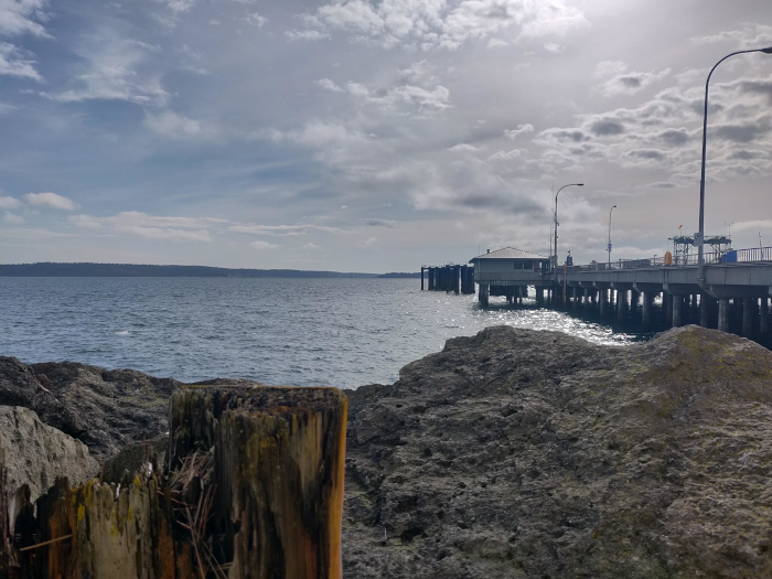 Juxtaposition Of Blue - Photo By Brandon K Montoya - A photo of a ferry terminal where the upper picture is very blue, and the objects closer are not. It's interesting.