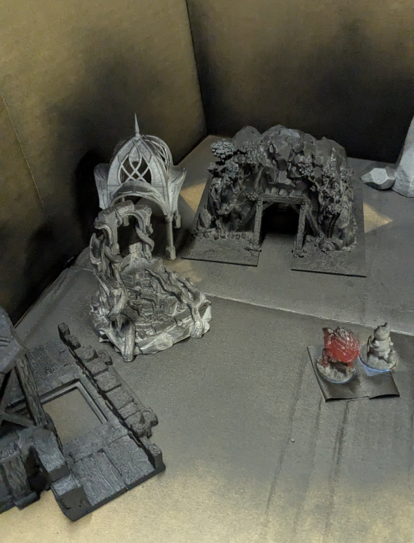 RPG terrain getting primed. This set up is simply carboard boxes forming a corner, with garbage backs to cover the cracks